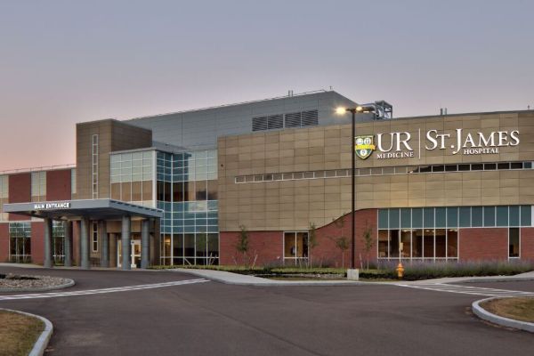 Front entrance of St. James Hospital, University of Rochester, showcasing modern architecture and welcoming atmosphere.